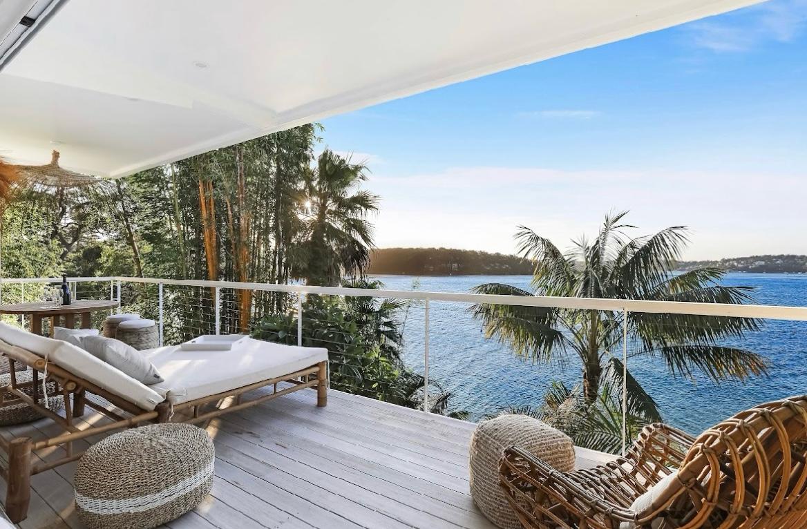 Tropical bay view with palm fronds