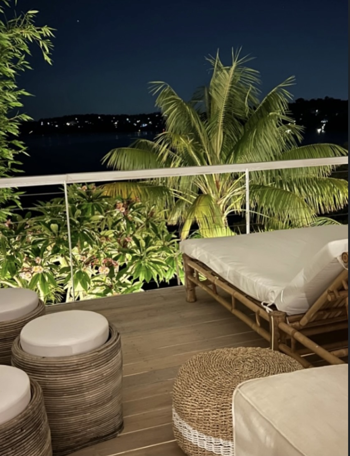 Night deck with bamboo lounger and tropical palms